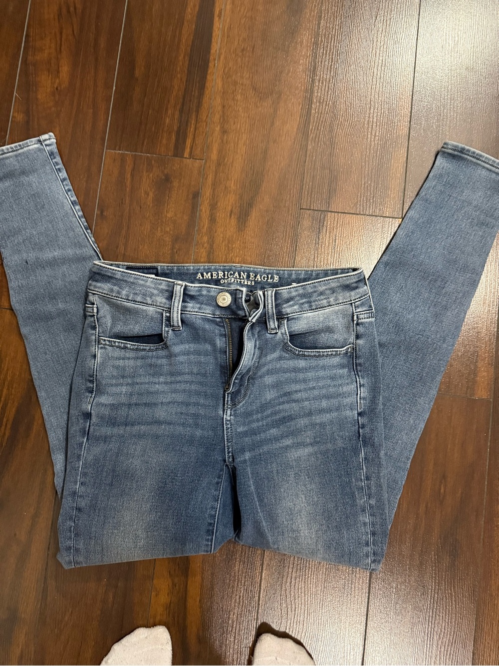 American Eagle Outfitters Women’s Mid-Rise Skinny Jeans in Faded Blue